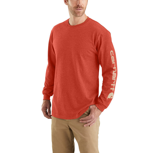 Man wearing a desert orange heather long-sleeve shirt with a visible carhartt brand logo on the left arm sleeve on a white background