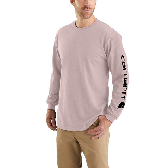 Man wearing a light mink purple long-sleeve shirt with a Carhartt logo on the left arm sleeve on a white background