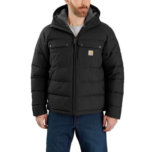 Man wearing a black Carhartt jacket on a white background