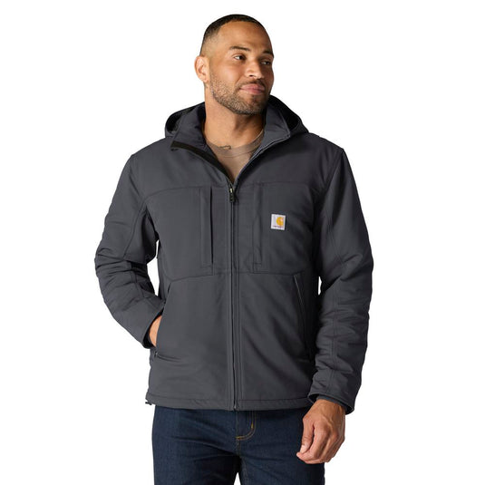 Man wearing a dark gray jacket with a visible Carhartt logo on a white background