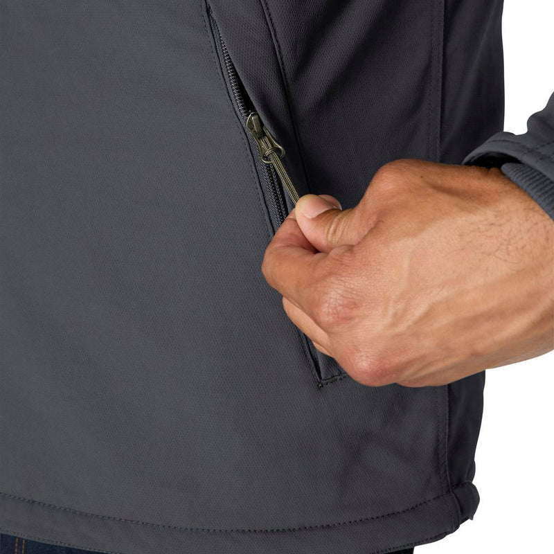 Load image into Gallery viewer, Close-up of a person's hand pulling a zipper on a dark gray softshell jacket, showing the texture of the fabric and the metal zipper pull.
