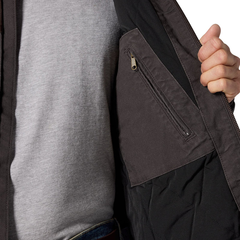 Load image into Gallery viewer, Close-up of a person wearing a dark charcoal gray jacket over a heather gray shirt, with a hand holding open the jacket to show a zippered pocket.
