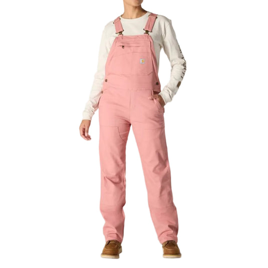 Woman wearing pink overalls on a white background
