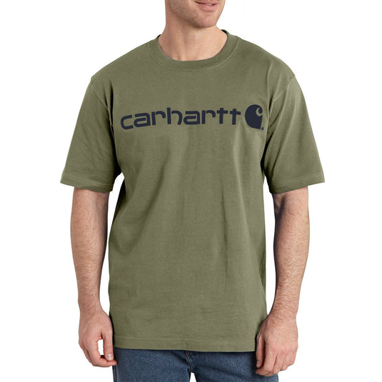 Man wearing a green Carhartt t-shirt on a white background