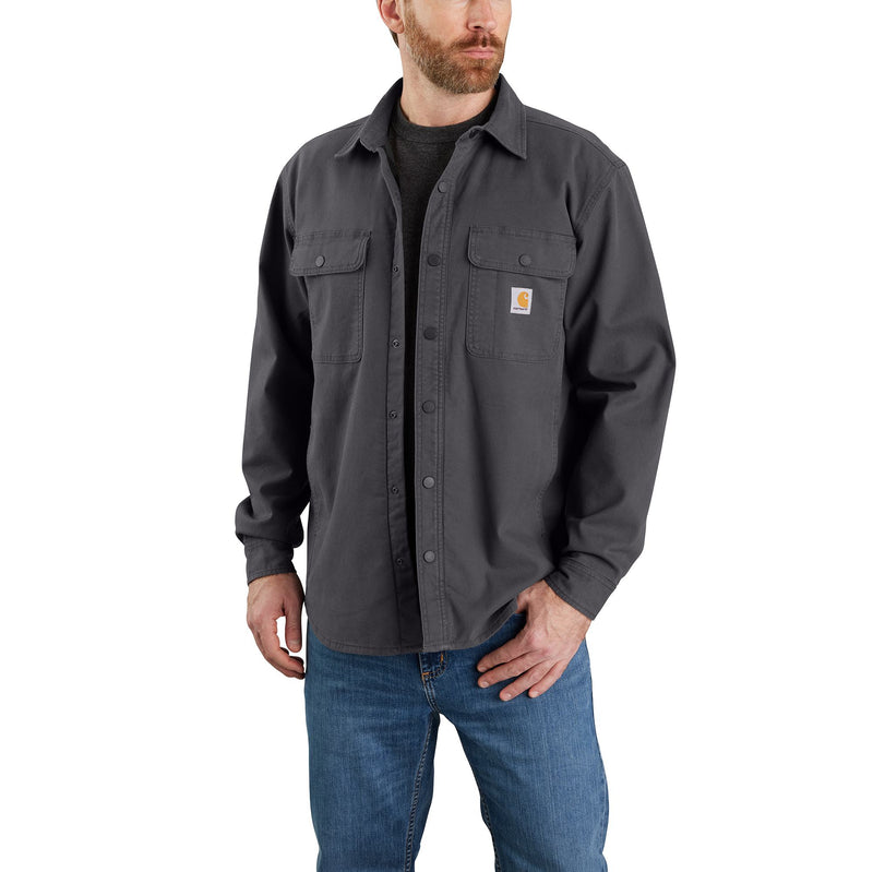 Load image into Gallery viewer, Man wearing a dark gray button-up shirt with a brand logo on a white background
