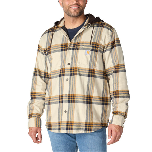 Front view of a man wearing a beige and brown carhartt plaid shirt jac flannel