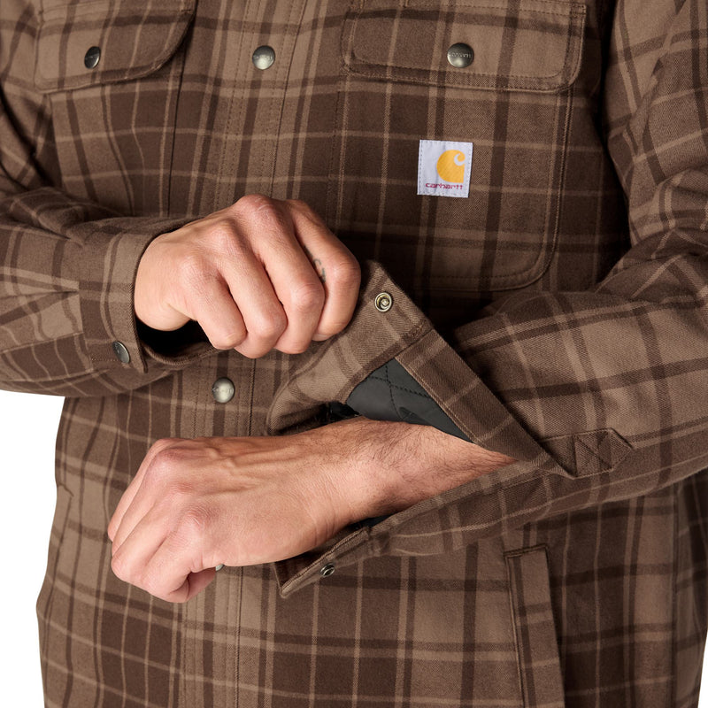 Load image into Gallery viewer, Closeup of the cuffs on a Carhartt plaid flannel with snap button closure and interior lining
