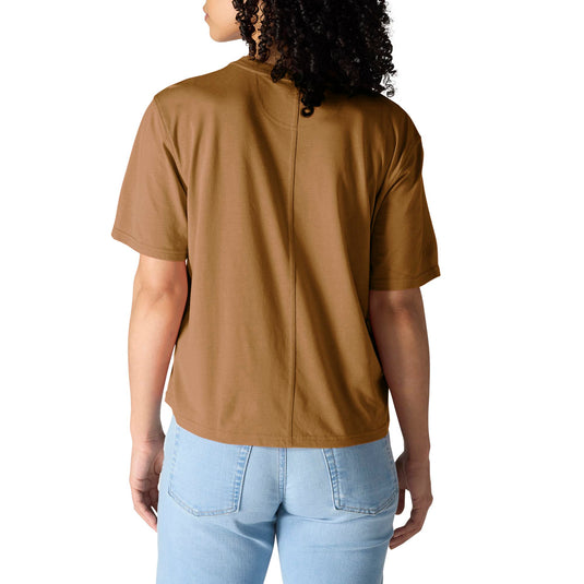 A woman viewed from the back wearing a brown short-sleeve crewneck t-shirt and light blue jeans, set against a plain white background.