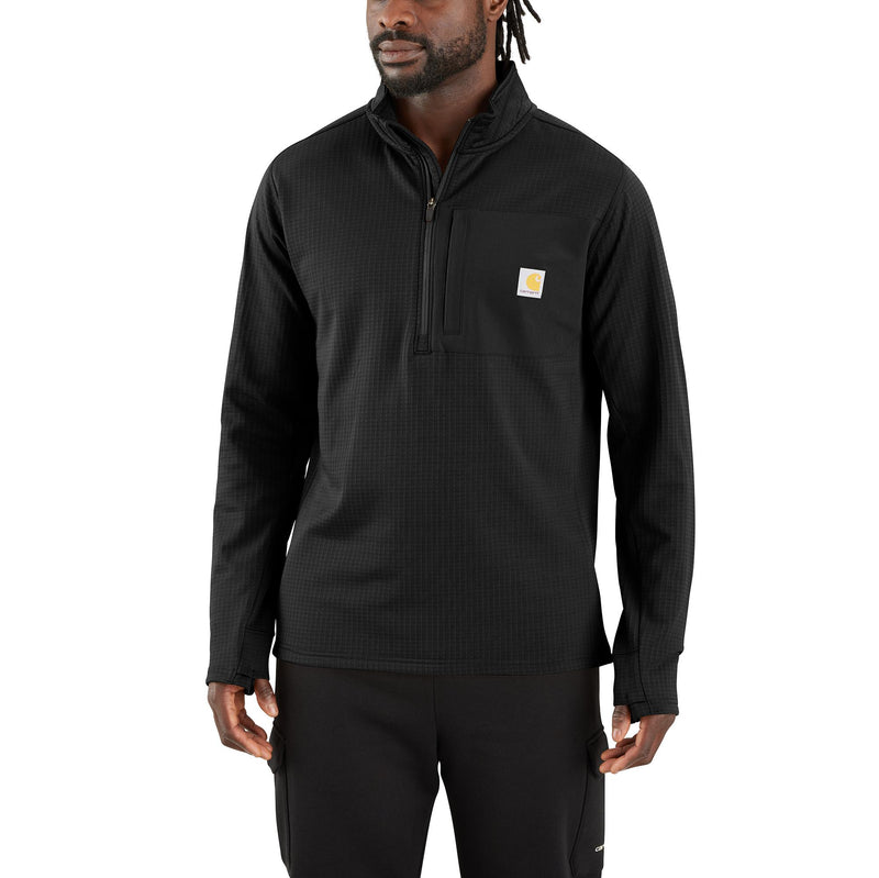 Load image into Gallery viewer, A man wearing a black Carhartt quarter-zip pullover with a small yellow and white Carhartt logo on the left chest, paired with black pants, against a plain white background.
