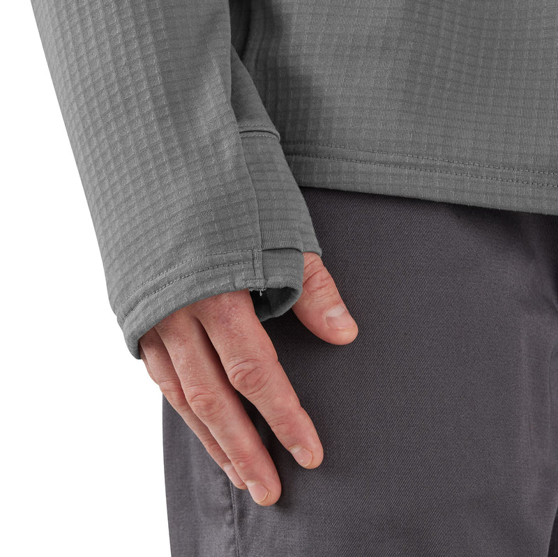 Load image into Gallery viewer, Close-up of a person's hand resting on the side of a gray textured long-sleeve top and dark gray pants, showing the sleeve cuff and fabric texture.
