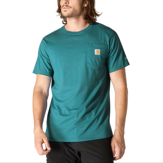 Man wearing a teal t-shirt with a visible Carhartt brand logo on the left chest pocket on a white background
