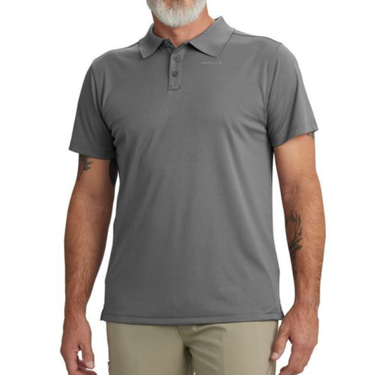 Man wearing a gray polo shirt and beige pants on a white background