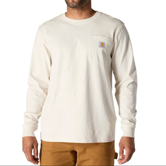 Man wearing a Malt/Beige long-sleeve shirt with a Carhartt brand logo stitched onto left chest pocket on a white background