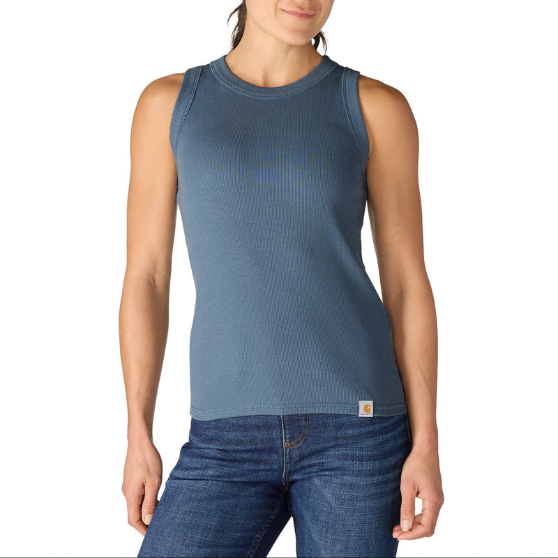 Load image into Gallery viewer, Woman wearing a blue sleeveless tank top and jeans on a white background
