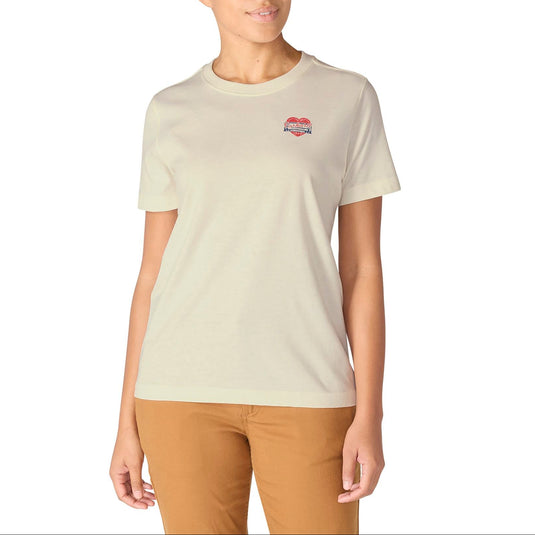 Woman wearing a beige t-shirt with a logo on a white background