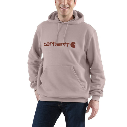 Person wearing a light pink Carhartt hoodie on a white background