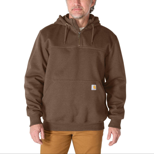 Man wearing a brown quarter-zip hoodie on a white background