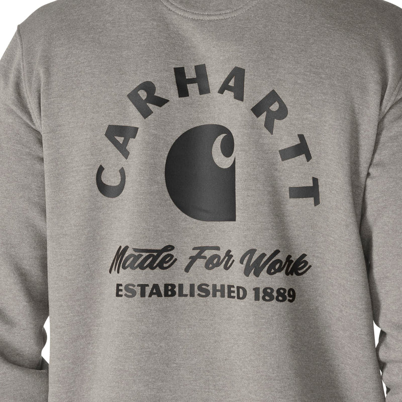 Load image into Gallery viewer, Close-up of a heather gray sweatshirt featuring a large black Carhartt logo and text on the front, including 'CARHART', 'Made For Work', and 'ESTABLISHED 1889'.
