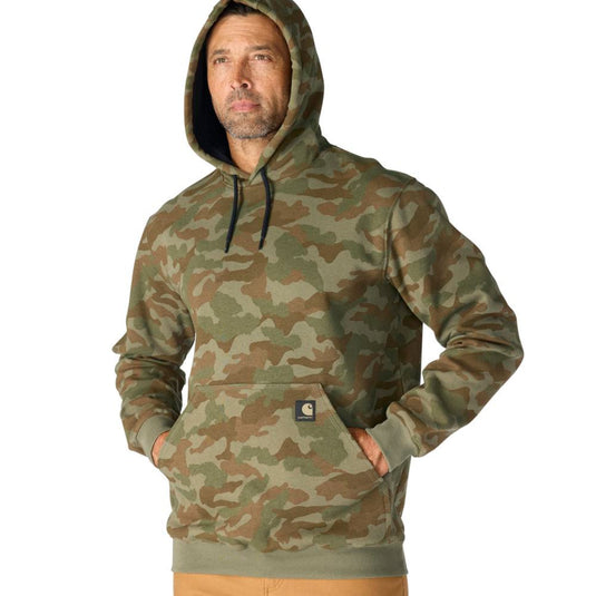 Man wearing a army green camouflage hoodie with a visible Carhartt brand logo on the front pocket with hoodie on on a white background