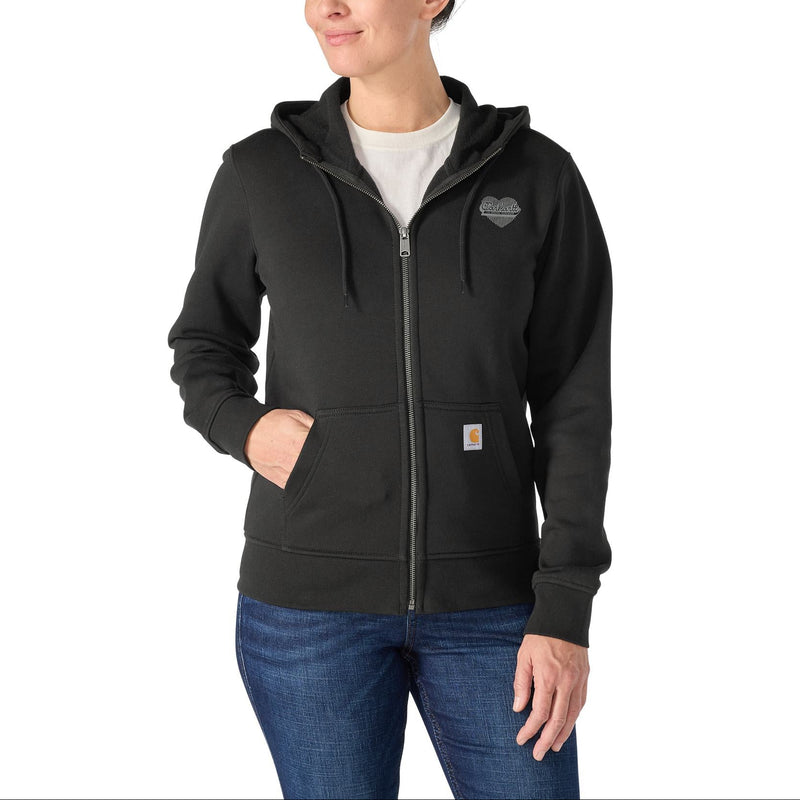 Load image into Gallery viewer, Woman wearing a black zip up Carhartt hoodie with front pockets and a heart Carhartt graphic on the chest
