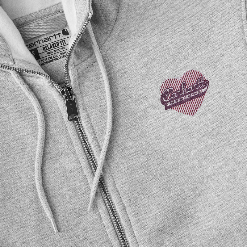 Load image into Gallery viewer, Close-up of a light gray heather zip-up hoodie with white drawstrings, a black zipper, and a pink striped heart-shaped Carhartt logo on the chest.
