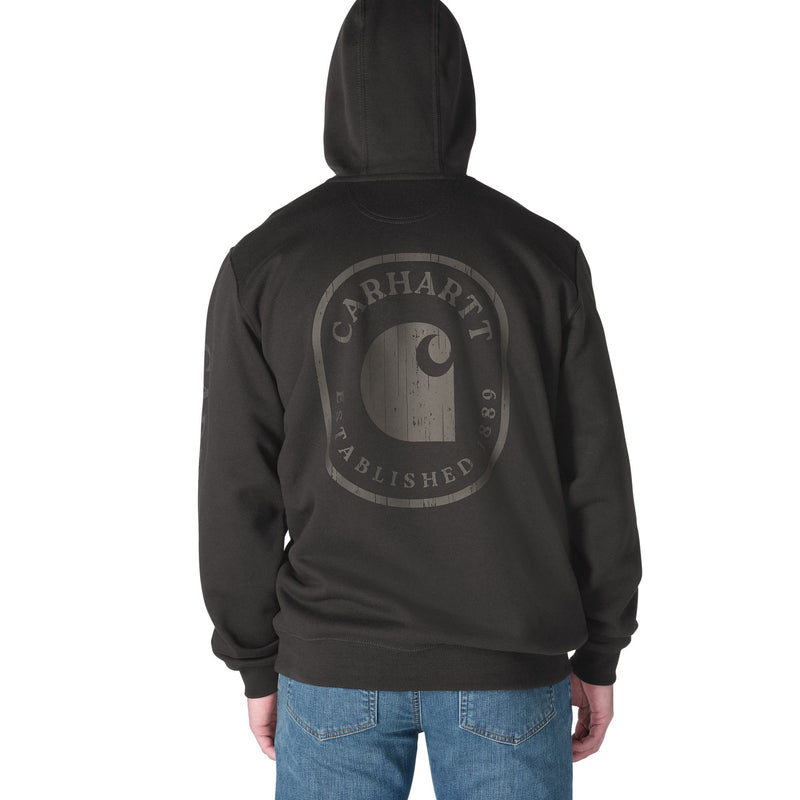 Load image into Gallery viewer, A person shown from the back wearing a dark charcoal hoodie with a large faded gray Carhartt logo graphic on the back, paired with blue jeans against a plain white background.
