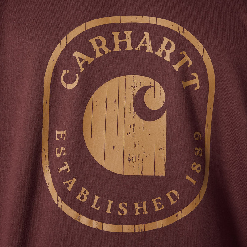 Load image into Gallery viewer, Close-up of a maroon t-shirt featuring a distressed tan graphic of the Carhartt logo and the words 'CARHARTT ESTABLISHED 1889'.
