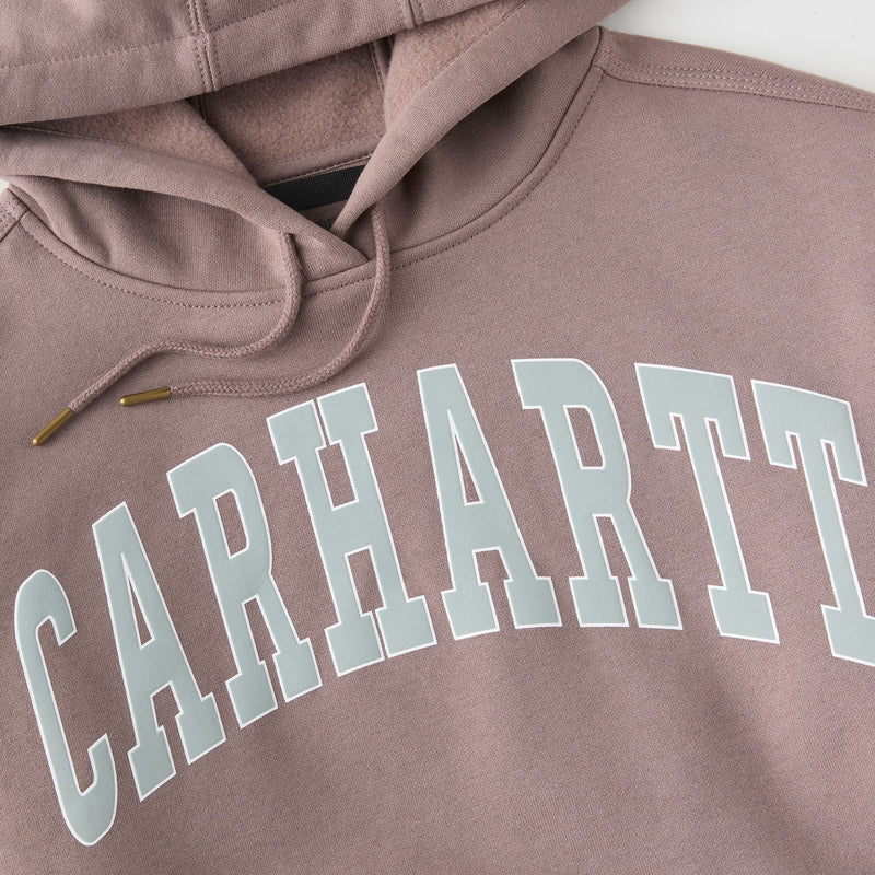 Load image into Gallery viewer, Close-up of a dusty mauve hoodie featuring a large, arched 'CARHARTT' logo printed across the chest in a light grayish-blue color.
