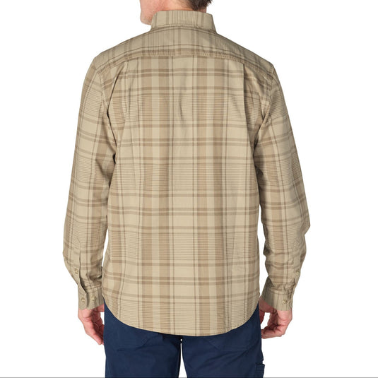 A man viewed from the back wearing a beige and brown plaid long-sleeve button-down shirt, paired with navy pants, against a plain white background.