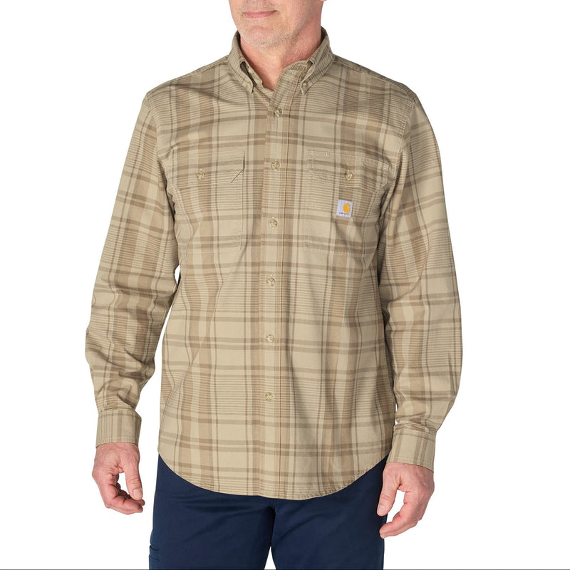 Load image into Gallery viewer, A man wearing a Carhartt long-sleeve button-down plaid shirt in beige and brown tones, paired with navy pants, against a plain white background.
