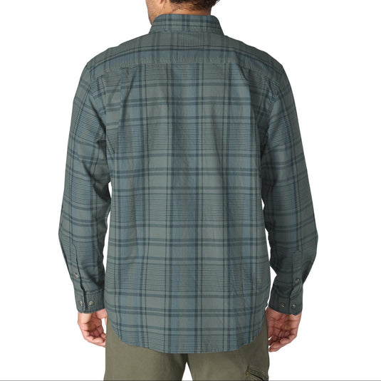 A man viewed from the back wearing a long-sleeve plaid button-up shirt in muted green and gray tones, paired with olive pants, against a plain white background.