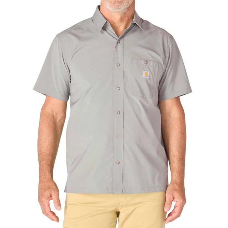 Load image into Gallery viewer, Man wearing a steel gray short-sleeve button-up shirt with a Carhartt logo patch on the left chest pocket on a white background
