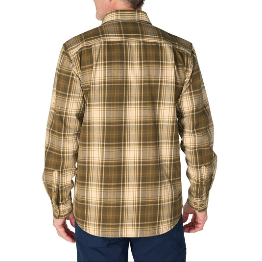 A man viewed from the back wearing a long-sleeve plaid button-up shirt in olive green and beige, paired with navy pants, against a plain white background.