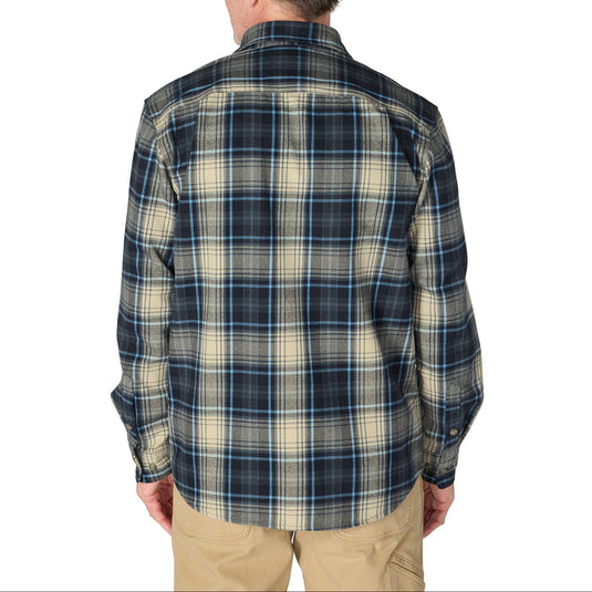 A man viewed from the back wearing a long-sleeve plaid button-up shirt in navy, beige, and white, paired with khaki pants, against a plain white background.