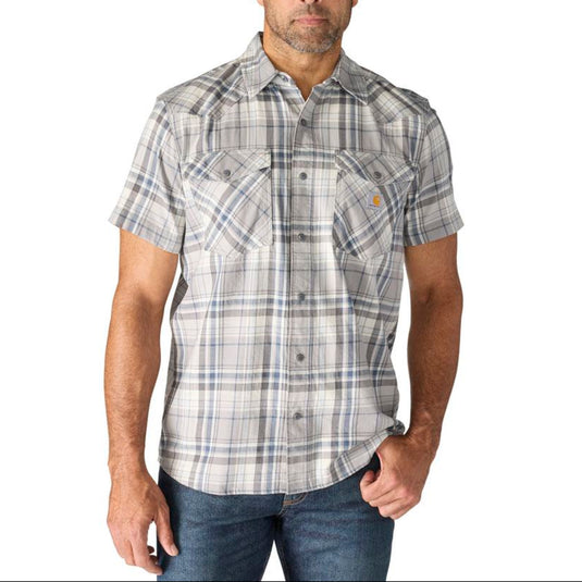 Man wearing a plaid shirt with a Carhartt logo on a white background