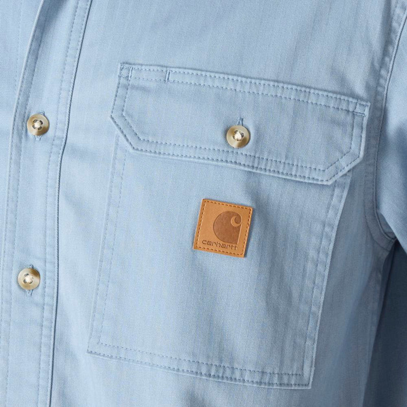 Load image into Gallery viewer, Light blue shirt with a Carhartt logo on a pocket
