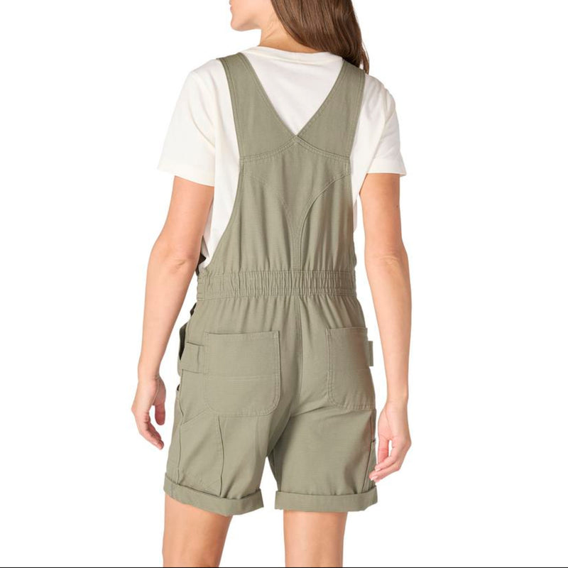 Load image into Gallery viewer, Woman wearing a green Carhartt shortalls with a white shirt underneath on a white background
