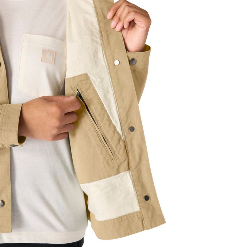 Load image into Gallery viewer, Close-up of a person wearing a beige jacket with an interior zipper pocket on a white background
