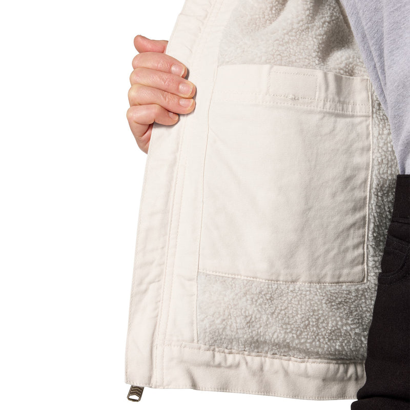 Load image into Gallery viewer, Close-up of a person holding open a light beige jacket to show the soft fleece lining and a large front patch pocket, against a plain white background.
