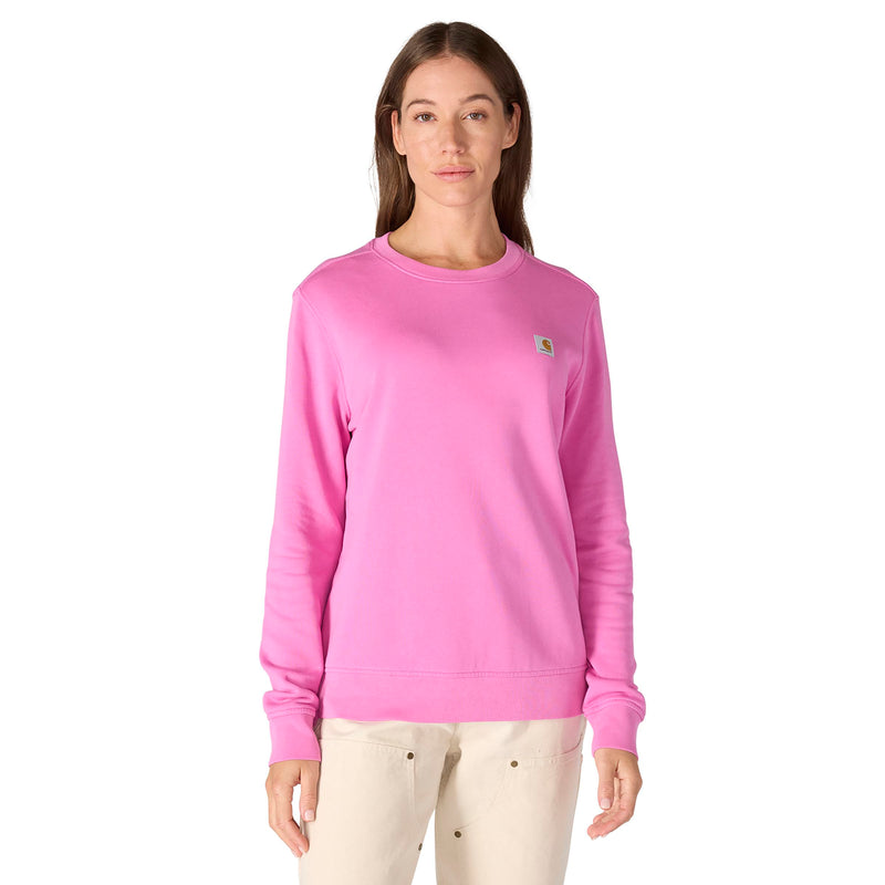 Load image into Gallery viewer, Person wearing a pink fleece crewneck sweatshirt with a Carhartt woven logo on the left chest a white background
