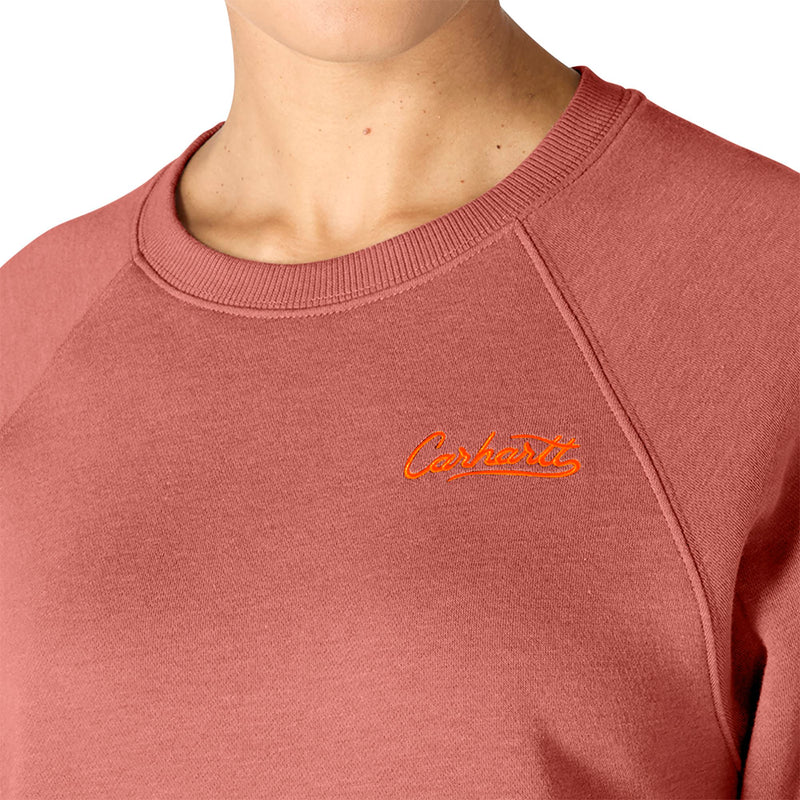 Load image into Gallery viewer, Close-up of a person wearing a dusty rose crewneck sweatshirt with an orange embroidered Carhartt logo on the chest.

