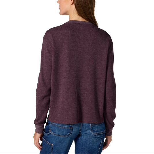 A woman shown from the back wearing a heathered dark plum long-sleeve crewneck top and blue jeans against a plain white background.