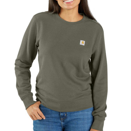 Person wearing a green sweatshirt with a Carhartt logo on a white background