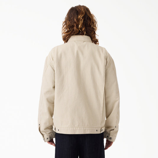 The back of a model wearing a timeless retro sand color hickory stripe painter's jacket.