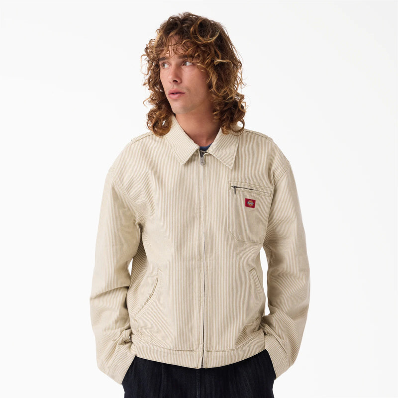 Load image into Gallery viewer, The front of a model wearing a timeless retro light brown hickory stripe painter's jacket.
