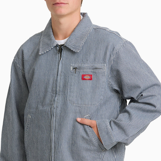 The close up of a model wearing a timeless retro indigo blue hickory stripe painter's jacket.