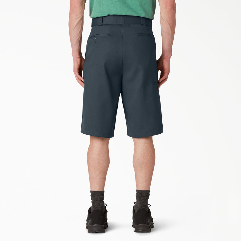 Load image into Gallery viewer, Rear view of a person wearing dark slate blue-gray shorts, a green shirt, black socks, and black shoes against a clean white studio background.
