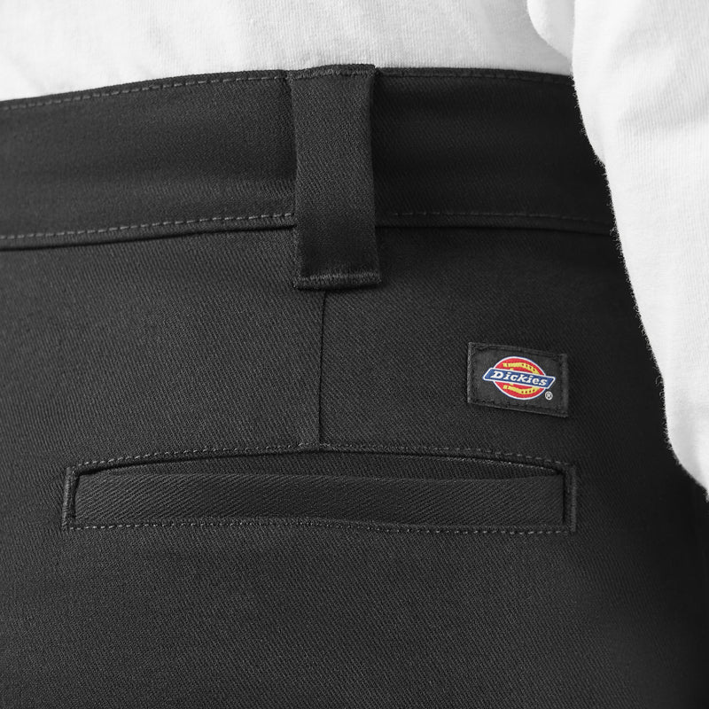 Load image into Gallery viewer, Black pants with a Dickies logo on the pocket against a white background
