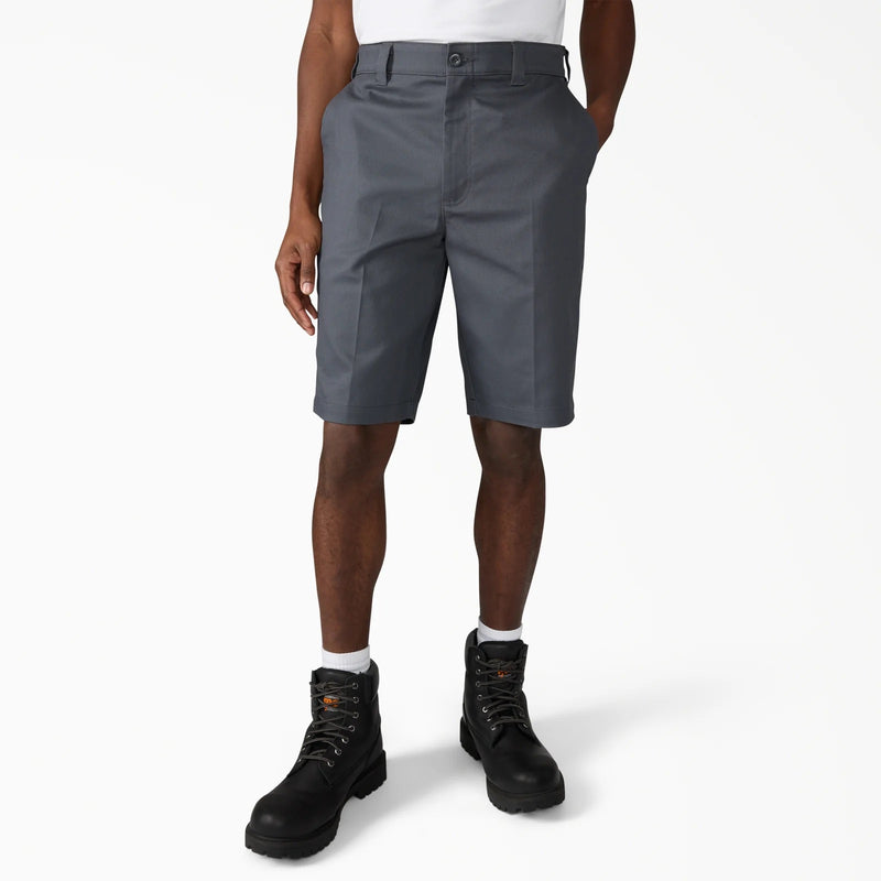 Load image into Gallery viewer, Person wearing gray shorts and black boots on a white background
