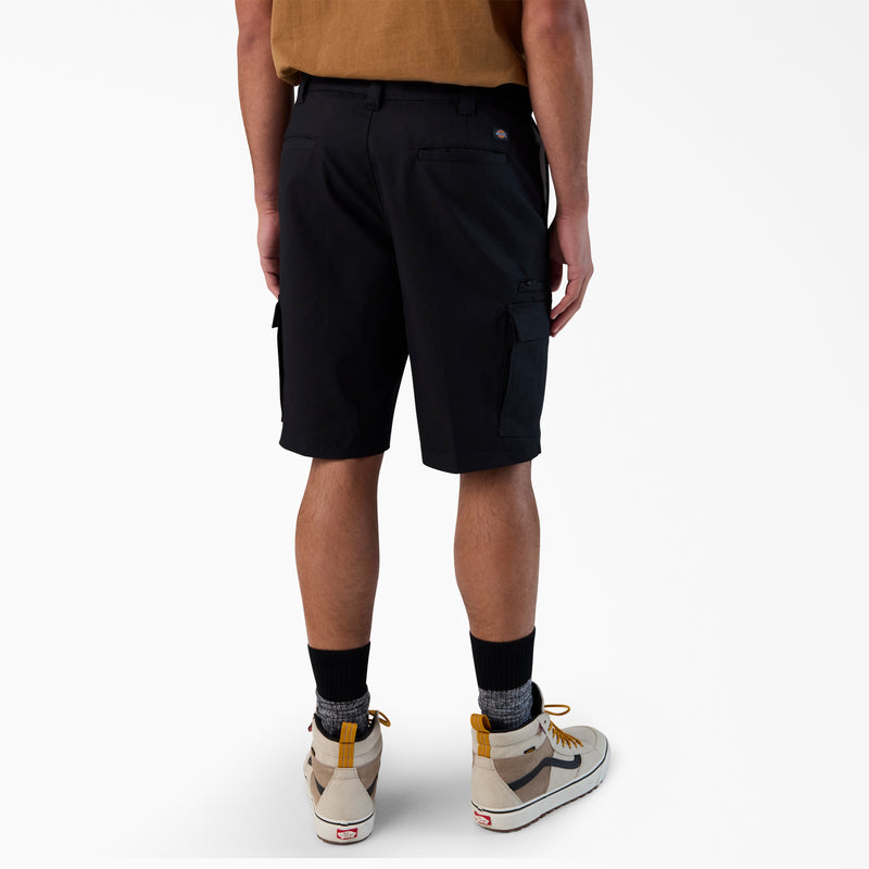 Load image into Gallery viewer, Person wearing black cargo shorts on a white background
